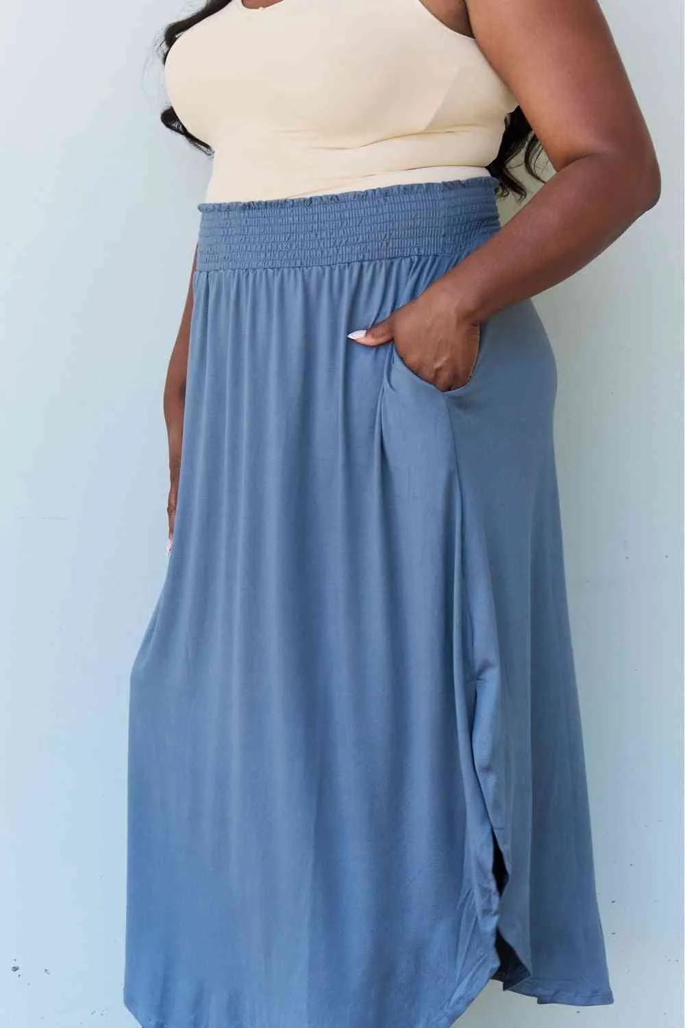 The Nina High Waist Scoop Hem Maxi Skirt in Dusty Blue